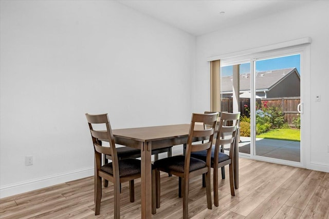 2062 N Osmun Ave, Clovis, CA 93619 - dining area with light wood-style floors and baseboards