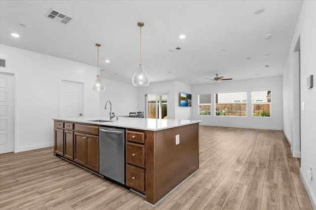 2062 N Osmun Ave, Clovis, CA 93619 - kitchen with stainless steel dishwasher, a ceiling fan, light wood finished floors, light countertops, and recessed lighting