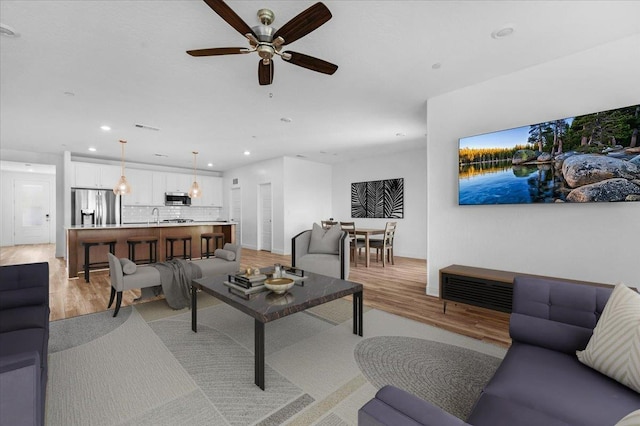 2062 N Osmun Ave, Clovis, CA 93619 - living area featuring light wood-style floors, recessed lighting, and a ceiling fan