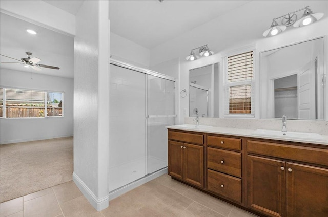 2062 N Osmun Ave, Clovis, CA 93619 - bathroom with a ceiling fan, a shower stall, double vanity, and tile patterned flooring
