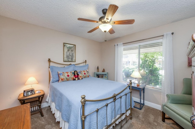 5090 N College Ave Unit 103, Fresno, CA 93704 - carpeted bedroom featuring a textured ceiling and ceiling fan