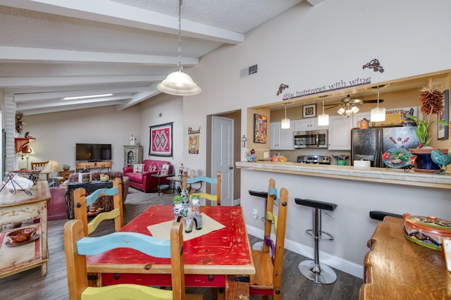 5090 N College Ave Unit 103, Fresno, CA 93704 - dining room with dark wood-style flooring and a textured ceiling