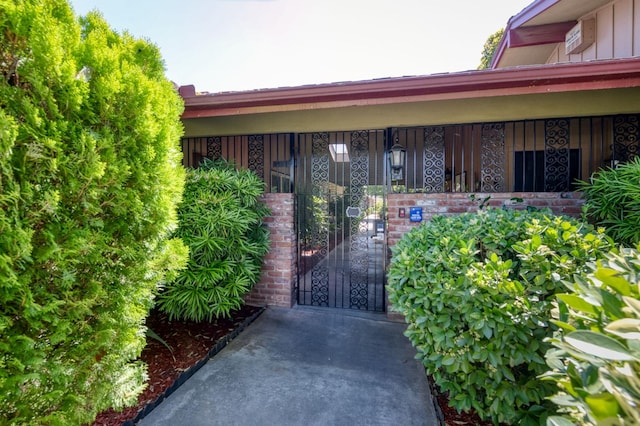 5090 N College Ave Unit 103, Fresno, CA 93704 - property entrance with board and batten siding and a gate