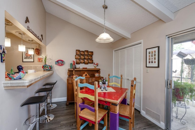 5090 N College Ave Unit 103, Fresno, CA 93704 - dining space featuring dark wood-style floors and a textured ceiling