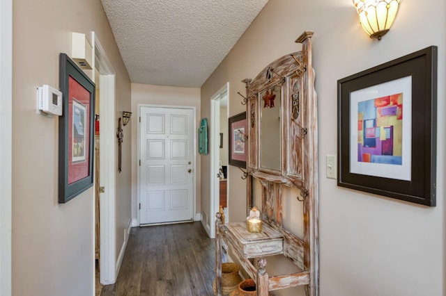 5090 N College Ave Unit 103, Fresno, CA 93704 - corridor featuring dark wood-type flooring and a textured ceiling