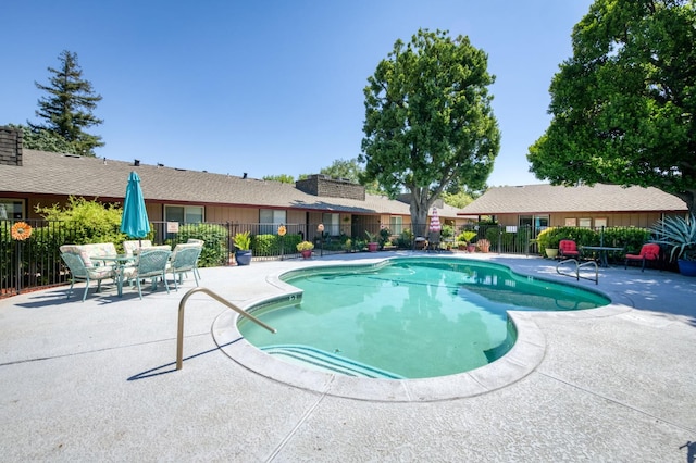 5090 N College Ave Unit 103, Fresno, CA 93704 - community pool featuring a patio area