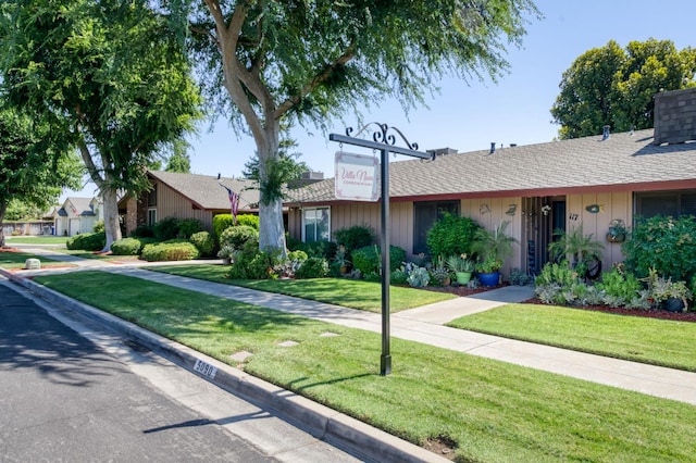 5090 N College Ave Unit 103, Fresno, CA 93704 - ranch-style home featuring a front lawn, roof with shingles, and a chimney