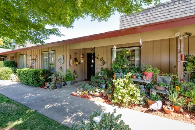 5090 N College Ave Unit 103, Fresno, CA 93704 - view of front of property featuring a shingled roof and board and batten siding