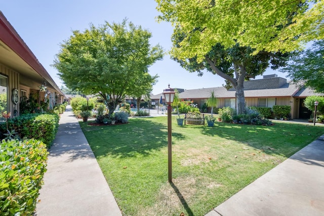 5090 N College Ave Unit 103, Fresno, CA 93704 - view of home's community featuring a lawn and a residential view