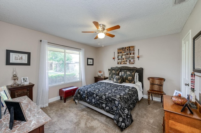 5090 N College Ave Unit 103, Fresno, CA 93704 - carpeted bedroom featuring a textured ceiling and ceiling fan