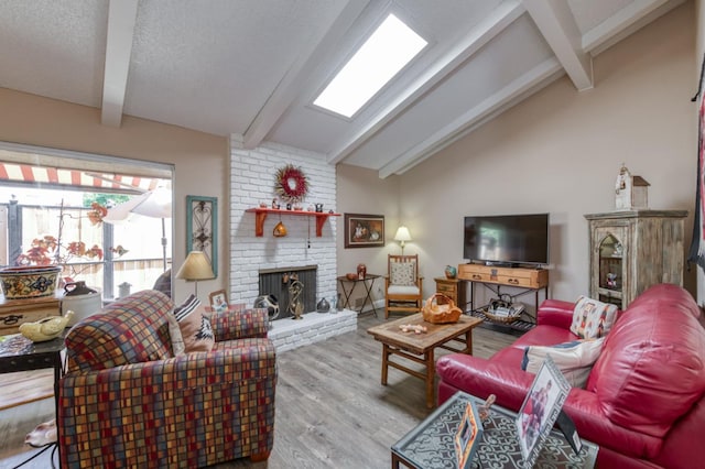 5090 N College Ave Unit 103, Fresno, CA 93704 - living area featuring a fireplace and wood finished floors