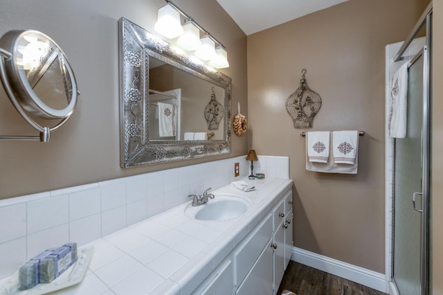 5090 N College Ave Unit 103, Fresno, CA 93704 - bathroom featuring a shower stall, vanity, and wood finished floors