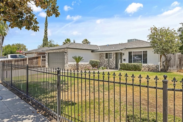 3012 W Santa Ana Ave, Fresno, CA 93722 - ranch-style home featuring stucco siding, a garage, stone siding, and driveway