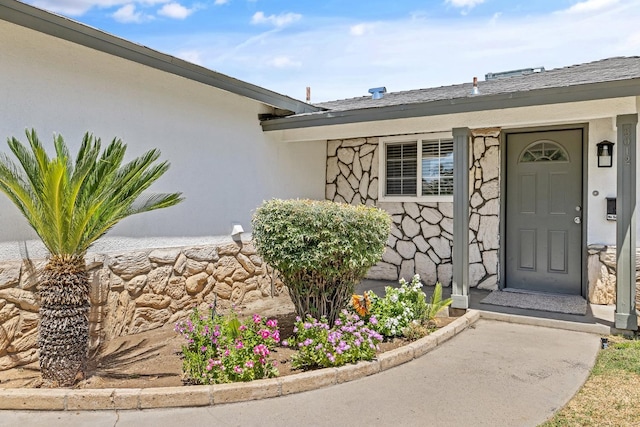 3012 W Santa Ana Ave, Fresno, CA 93722 - doorway to property featuring stucco siding