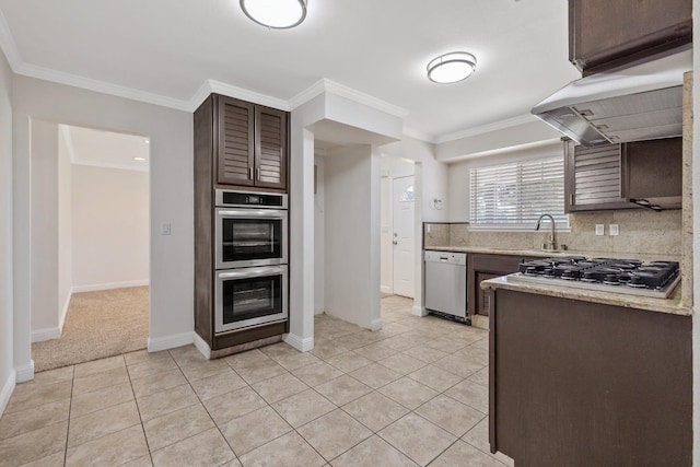3012 W Santa Ana Ave, Fresno, CA 93722 - kitchen featuring stainless steel appliances, dark brown cabinets, light tile patterned floors, tasteful backsplash, and ornamental molding