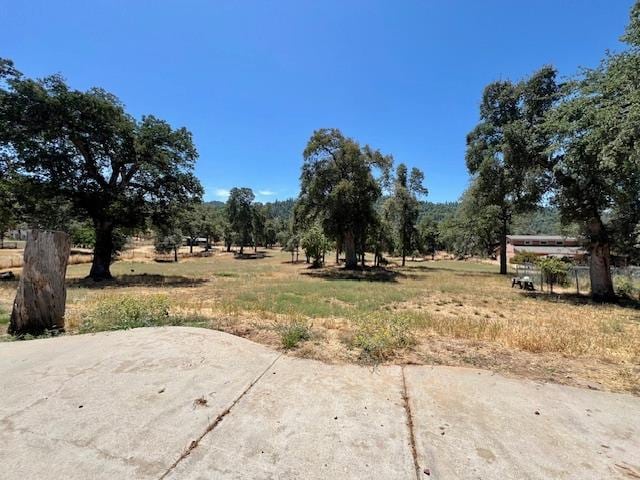 50601 Barcus Cir, Coarsegold, CA 93614 - view of yard featuring a patio area and a view of rural / pastoral area