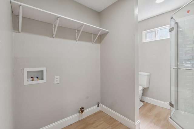 4545 E Grant Ave, Fresno, CA 93702 - laundry room featuring washer hookup and light wood-style floors