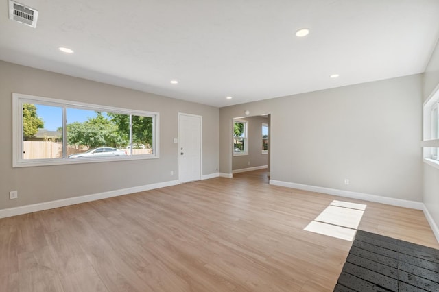 4545 E Grant Ave, Fresno, CA 93702 - unfurnished living room with light wood finished floors and recessed lighting