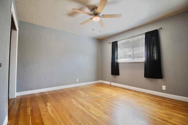 3377 E Richert Ave, Fresno, CA 93726 - empty room with ceiling fan, hardwood / wood-style flooring, and a textured ceiling