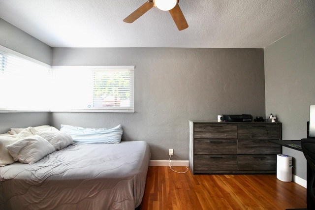 3377 E Richert Ave, Fresno, CA 93726 - bedroom featuring wood finished floors, a textured ceiling, a textured wall, and ceiling fan