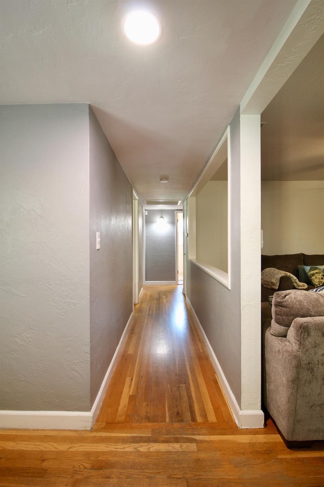 3377 E Richert Ave, Fresno, CA 93726 - hall featuring wood finished floors and a textured wall