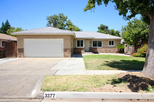 3377 E Richert Ave, Fresno, CA 93726 - ranch-style house featuring stone siding, stucco siding, and a garage