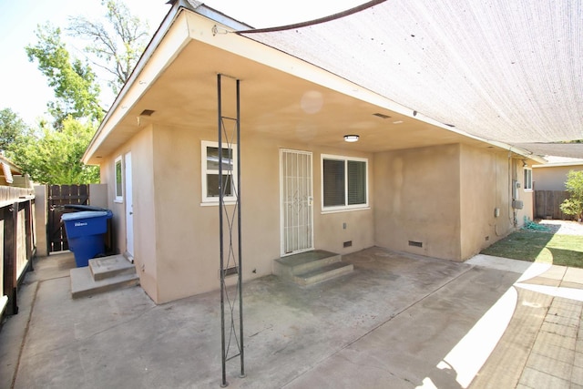 3377 E Richert Ave, Fresno, CA 93726 - rear view of property featuring crawl space, stucco siding, and a patio
