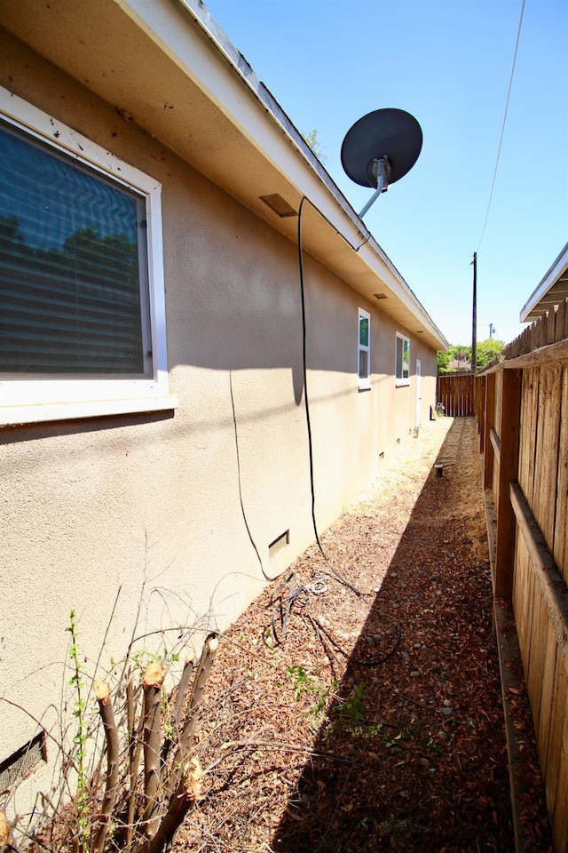 3377 E Richert Ave, Fresno, CA 93726 - view of home's exterior with stucco siding and a fenced backyard