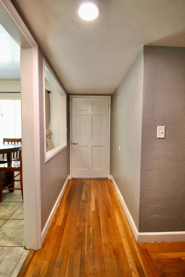3377 E Richert Ave, Fresno, CA 93726 - hallway featuring wood finished floors and a textured wall