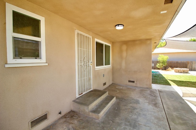3377 E Richert Ave, Fresno, CA 93726 - entrance to property with crawl space, stucco siding, and a patio