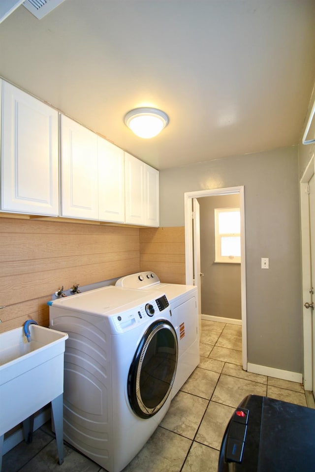 3377 E Richert Ave, Fresno, CA 93726 - washroom featuring cabinet space, separate washer and dryer, and light tile patterned floors
