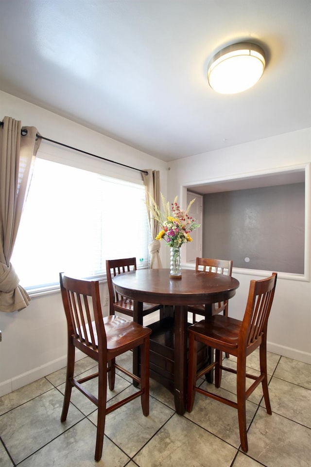 3377 E Richert Ave, Fresno, CA 93726 - dining room featuring baseboards and light tile patterned flooring