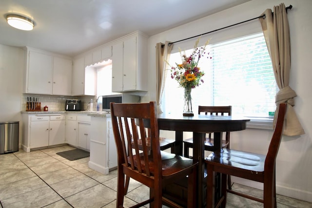 3377 E Richert Ave, Fresno, CA 93726 - dining space with light tile patterned flooring