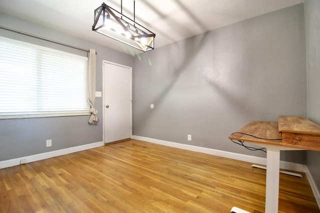 3377 E Richert Ave, Fresno, CA 93726 - unfurnished dining area featuring wood finished floors and baseboards