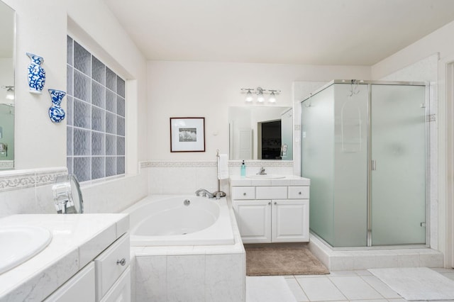 40416 Wild Rose Ln, Shaver Lake, CA 93664 - full bathroom with two vanities, a stall shower, a bath, tile patterned floors, and tile walls