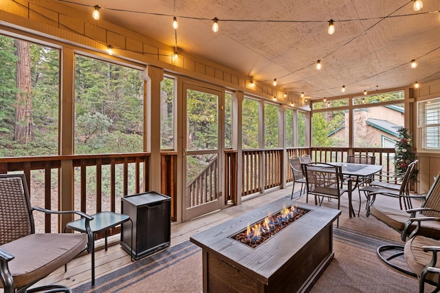 40416 Wild Rose Ln, Shaver Lake, CA 93664 - sunroom with a fire pit and outdoor dining space