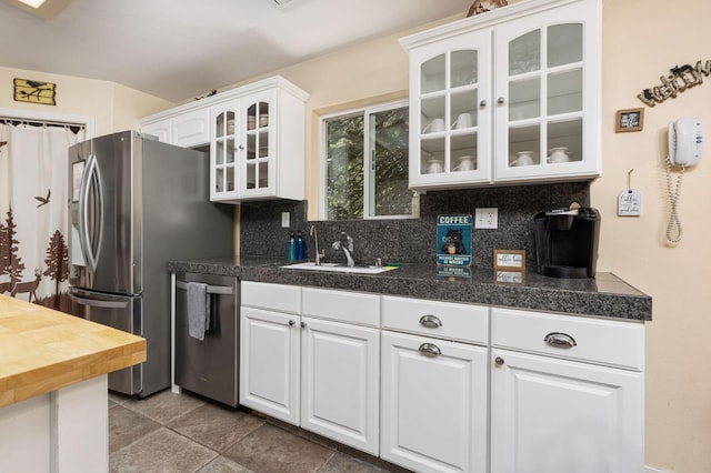 40416 Wild Rose Ln, Shaver Lake, CA 93664 - kitchen with stainless steel appliances, tile countertops, decorative backsplash, white cabinets, and glass insert cabinets