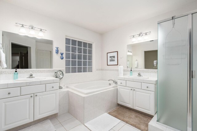 40416 Wild Rose Ln, Shaver Lake, CA 93664 - bathroom featuring tile patterned floors, two vanities, a garden tub, and a shower stall