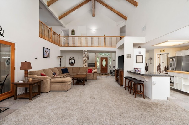 40416 Wild Rose Ln, Shaver Lake, CA 93664 - living room featuring high vaulted ceiling, light colored carpet, and beam ceiling