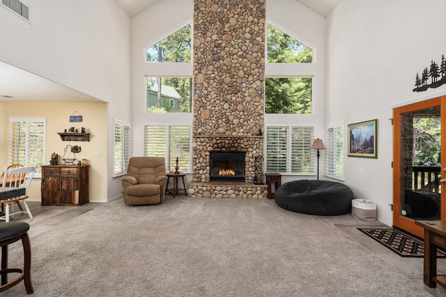 40416 Wild Rose Ln, Shaver Lake, CA 93664 - living area with a towering ceiling, carpet flooring, plenty of natural light, and a fireplace