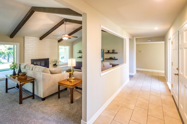 2805 W Spruce Ave, Fresno, CA 93711 - living room with a ceiling fan, a brick fireplace, and light tile patterned floors