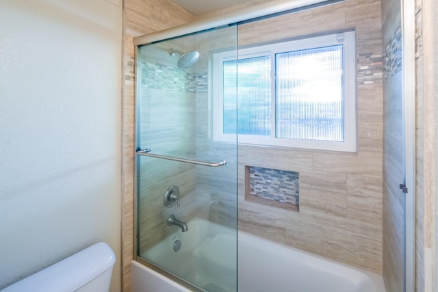 2805 W Spruce Ave, Fresno, CA 93711 - bathroom featuring shower / bath combination with glass door and toilet