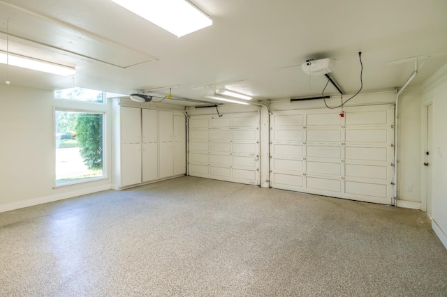 2805 W Spruce Ave, Fresno, CA 93711 - garage with baseboards and a garage door opener