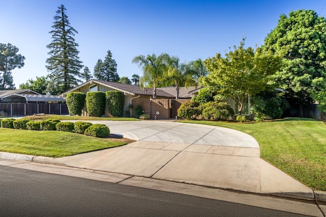 2805 W Spruce Ave, Fresno, CA 93711 - view of front of property featuring curved driveway and a front yard