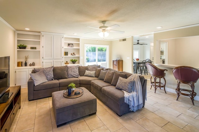 2805 W Spruce Ave, Fresno, CA 93711 - living room with ceiling fan, crown molding, recessed lighting, built in features, and light tile patterned floors