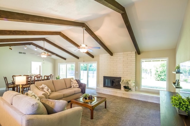2805 W Spruce Ave, Fresno, CA 93711 - carpeted living room with ceiling fan, plenty of natural light, and a fireplace