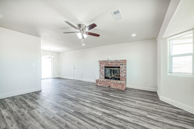 19930 Olympia Rd, Madera, CA 93638 - unfurnished living room featuring healthy amount of natural light, ceiling fan, a chandelier, wood finished floors, and recessed lighting