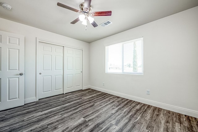 19930 Olympia Rd, Madera, CA 93638 - unfurnished bedroom with dark wood-type flooring, a closet, and ceiling fan