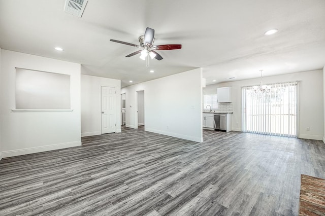 19930 Olympia Rd, Madera, CA 93638 - unfurnished living room featuring a chandelier, wood finished floors, ceiling fan, and recessed lighting