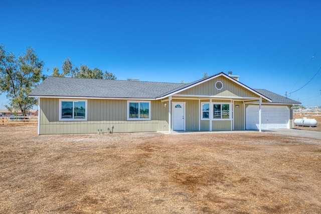 19930 Olympia Rd, Madera, CA 93638 - single story home featuring an attached garage, roof with shingles, and driveway